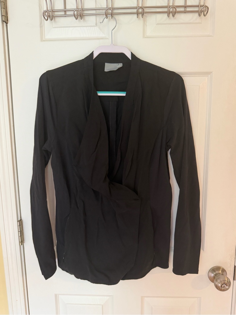 Black Draped snap front Athletic top.  Thumb holes with detail.